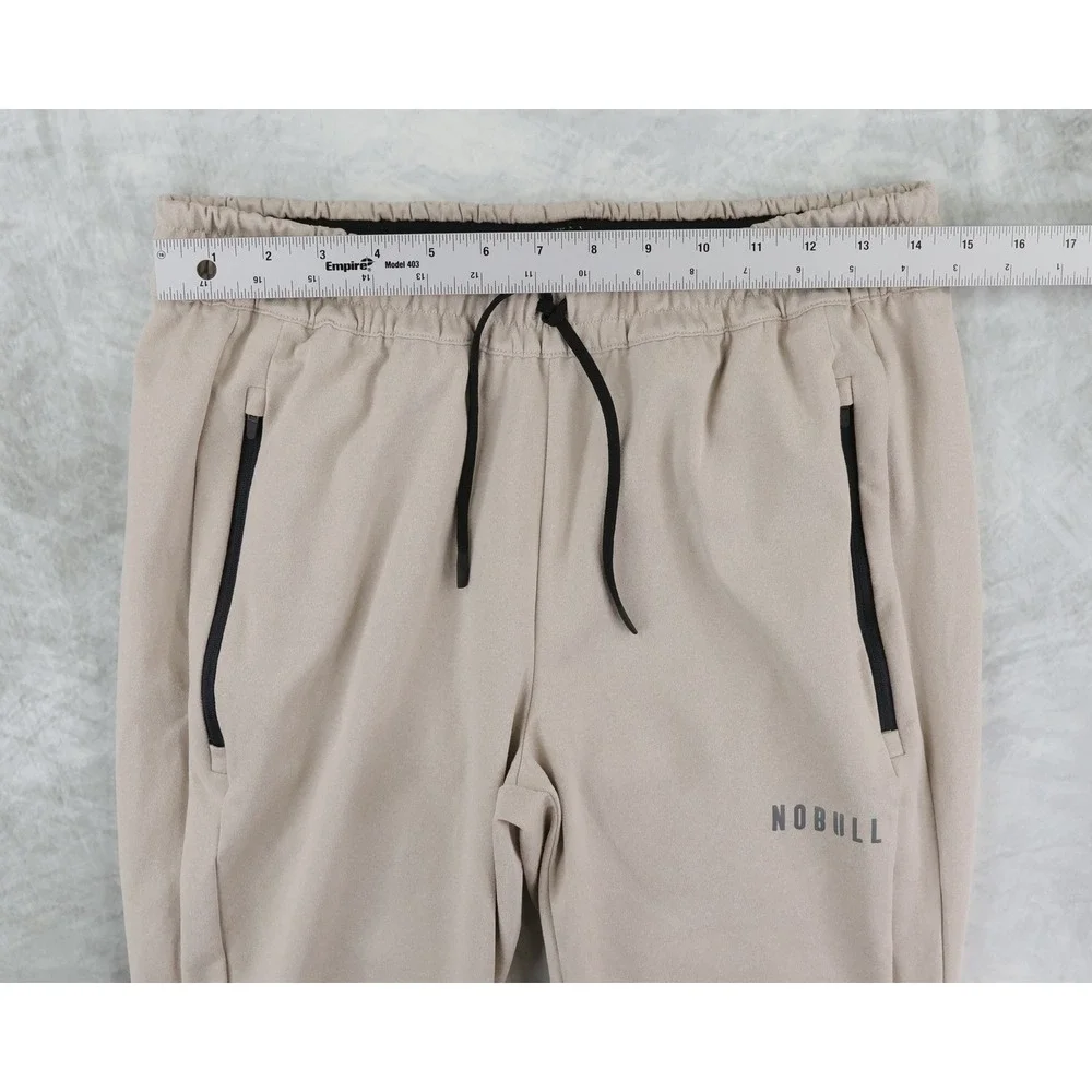 NOBULL Jogger Pants Mens Medium Tan Zipper Pockets Tapered Training Sweatpants
